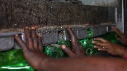 View of workers sorting green plastic bottles in Bogura, Bangladesh. Stock Footage 336424536
