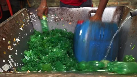 View of workers sorting plastic bottles for recycling, Bangladesh. Video stock 336424749