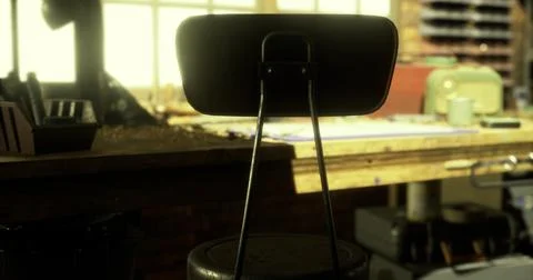 View of a workshop with sunlight streaming through windows on a wooden table Stock Illustration