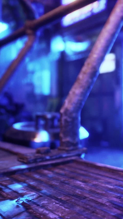 View of a workspace with metal tools and blue lighting effects in a workshop Stock Footage 335689080