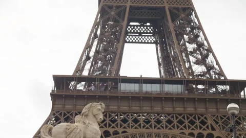 View of the wrought-iron lattice Eiffel Tower from the Pont d'Iena bridge. Stock Footage 310178360