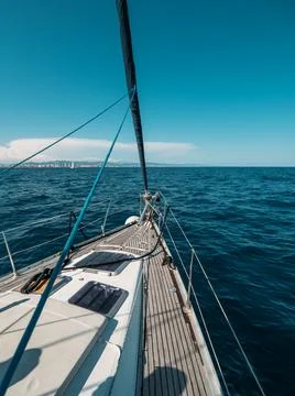 View from yacht prow heading in mediterranean sea with deep blue water in summer Photos