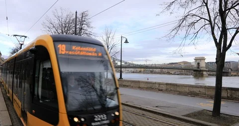 A view of yellow tram with Chain bridge Stock Footage 102234226