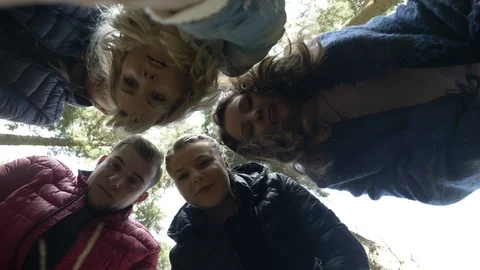 Up view of young curious explorers hiking in the woods discovering something  Video stock 86219302