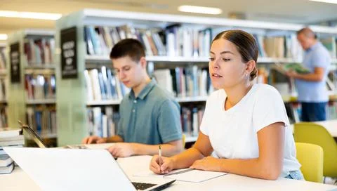 View on young european students studying together Stock Photos