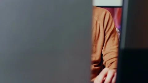 View of young game developer working on computer Stock Footage 125138981