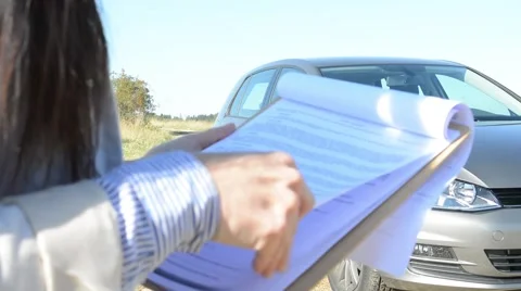 View of the young girl with papers in the folder  Stock Footage 58501126