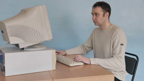 View Of Young Man Programmer Working At Retro Computer Stock Footage 126095434