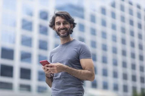 View of a young man with smartphone Stock Photos