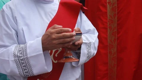 View of a young priest giving the host during a mass in Central America Stock Footage 86522967