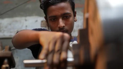 View of a young worker operating a lathe in Bogura, Bangladesh. Video stock 335584558