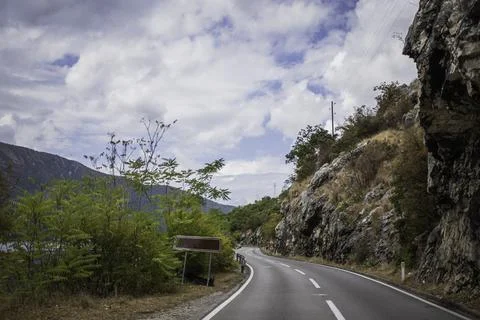 View of a zig zag road along Kotor Bay during a cloudy day, Montenegro. Stock Photos