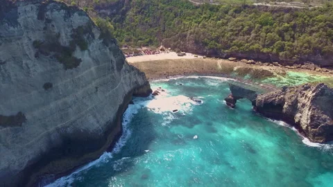 Viewed from the air, the gentle lapping of turquoise colored crystal clear ocean Stock Footage 294658923