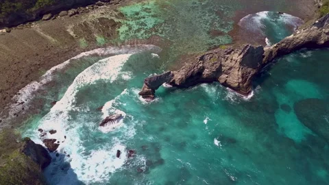 Viewed from the air, the gentle lapping of turquoise colored crystal clear ocean Video stock 294658980