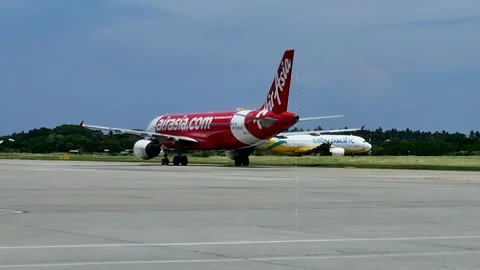 Viewed through glass, a jetliner parks at Caticlan airport, gateway to Boracay Stock Footage 337690431