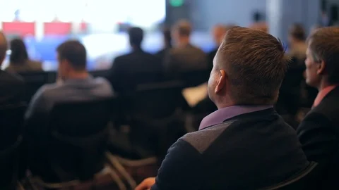 Viewers look at the screen in a large hall Stock Footage 87026654