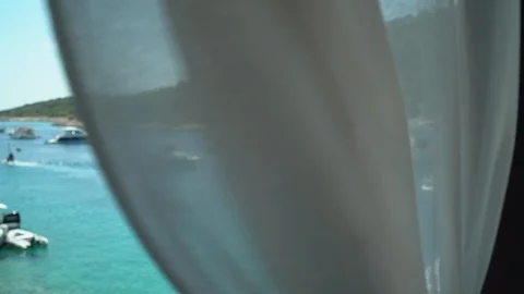 Viewing boats in harbor from window Stock Footage 125768271