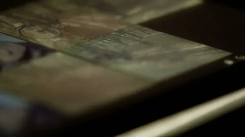 Viewing images on a touchscreen in the dark Stock Footage 48065458