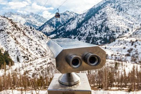 Viewing machine on the viewpoint on the top of the mountain, winter conditions Stock Photos