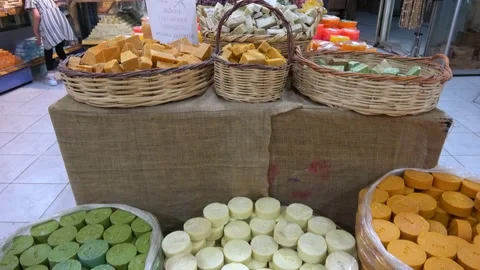 Viewing natural soaps in the authentic shop and a girl Stock Footage 161893577