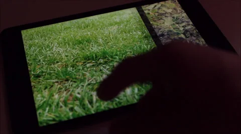 Viewing photos on a tablet Stock-Footage 37085286