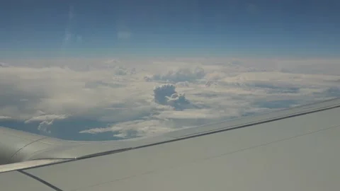 Viewing plane wing and cauliflower clouds Video stock 154419467