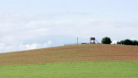 Viewing platform, observation tower in rural landscape, overlooking farmland Stock Footage 160137387