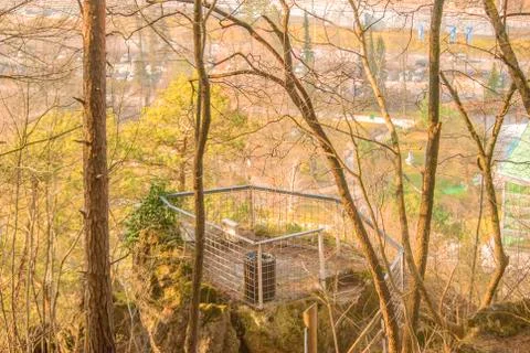 Viewing point with fence at forest path going on top of the hill. Stock Photos