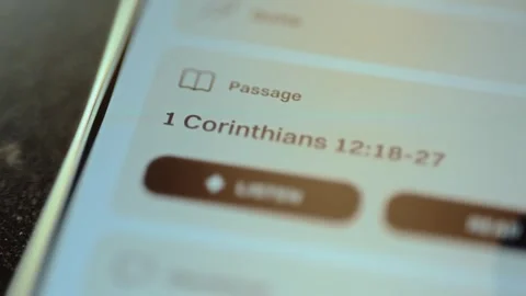 Viewing the specific Bible passage 1 Corinthians 12:18-27 on a Christian app Stock Footage 327522918