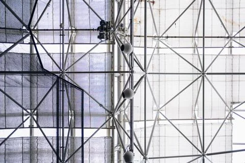 Viewing the structure of a large indoor space with a grid design and fabric.. Фото