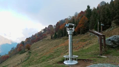 Viewing telescope on panoramic platform overlooking alpine mountains and valleys Stock Footage 324960854