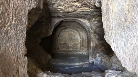 Viewing top down inside of a rock tomb Stock Footage 157059990