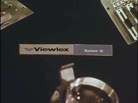 A Viewlex Systems 16 projector is disassembled and reassembled, in a studio, in Stock Footage 79458711