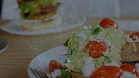 Viewpoint drifting left, shifting avocado toast right, revealing burger Stock Footage 315535896