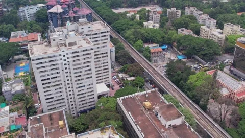 Viewpoint of an office building from above featuring a terrace and a metro Stock Footage 255240084