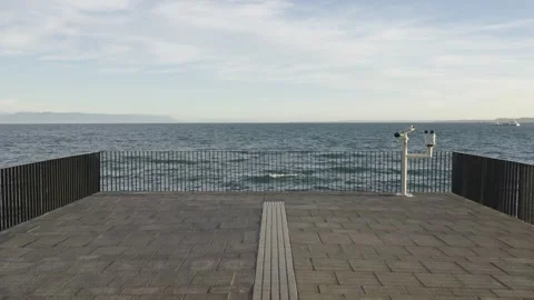 Viewpoint Over Ocean with Binoculars on Pier Stock Footage 308578285