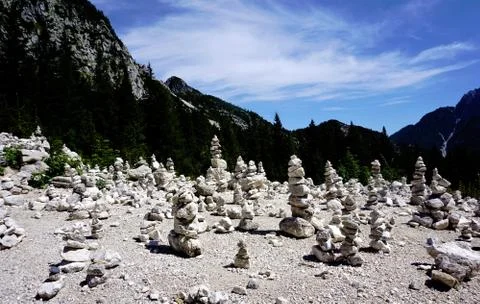 Viewpoint with stone piles, Vrsic pass and Triglav Mountains Stock Photos