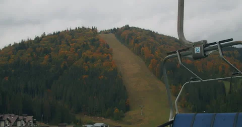 Views of the Bukovel ski resort, beautiful autumn trees and mountains, houses in Stock Footage 220224964