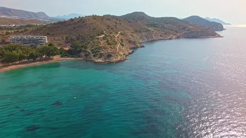 Views of a calm beach and clear water at a summer resort in the afternoon Stock Footage 339598037