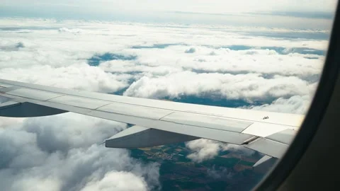 Views of the clouds from the window of an airplane. Concept: airlines, plane Stock Footage 154162399