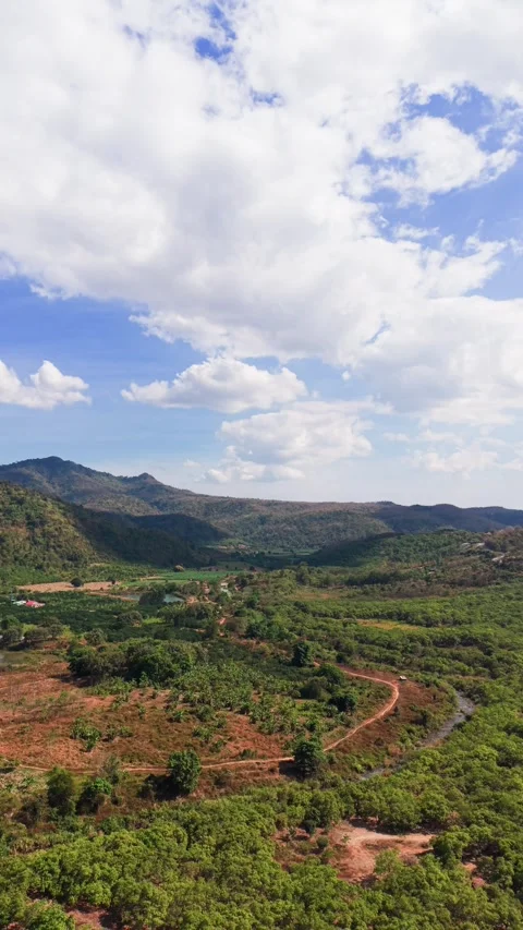 Views from Dai Ninh Pass show hills and valleys below with a mix of clouds in 스톡 동영상 333669299