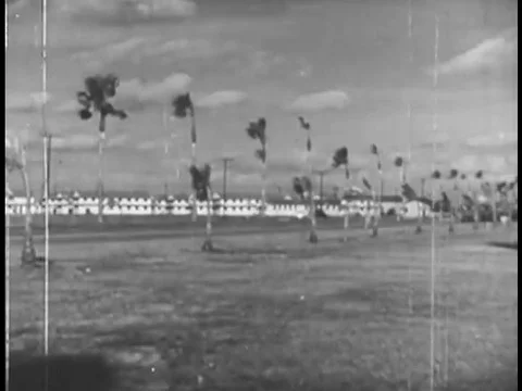 Views of different military bases exploding are followed by people working to Stock Footage 74964020