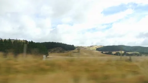Views of fields and hills in the movement, New Zealand Video stock 44652444