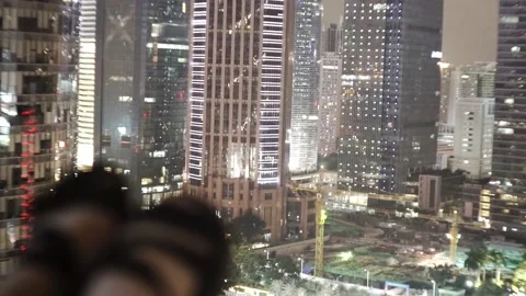 Views of large skyscrapers from the rooftops of buildings. Stock Footage 155360145