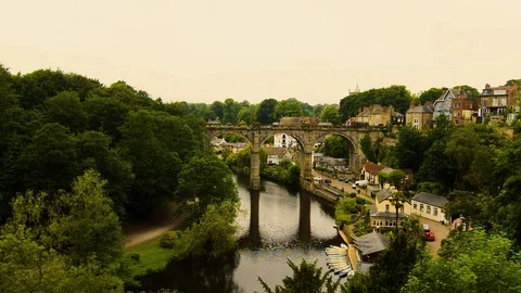 Views of the Nidd River, the old bridge and rowing boats from the ruins of Kn Stock Footage 128461783
