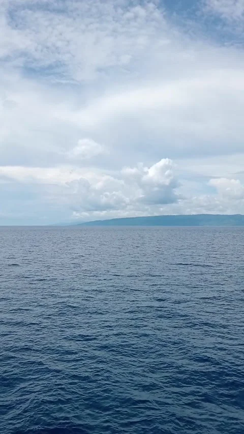 Views of the ocean and mountains with clouds Stock Footage 292640318