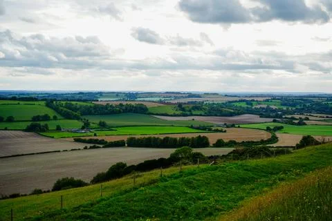 Views over patchwork farm fields in the United Kingdom Stock Photos