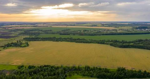Views of the ravines, the fields with the quadcopter in the rays Stock Photos