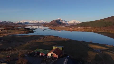 Views of a river and mountains during sunset in a rural area of Norway Stock Footage 334774139