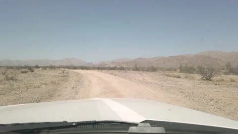 Views off roading from the front window-shield on a dirt road in Baja, Mexico Stock Footage 166663147
